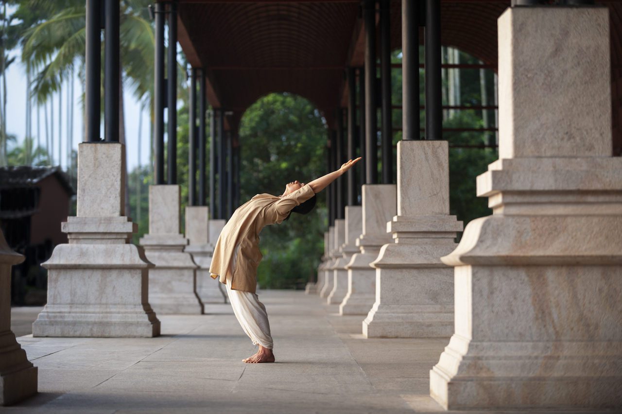 Dynamic yoga backbend pose at temple