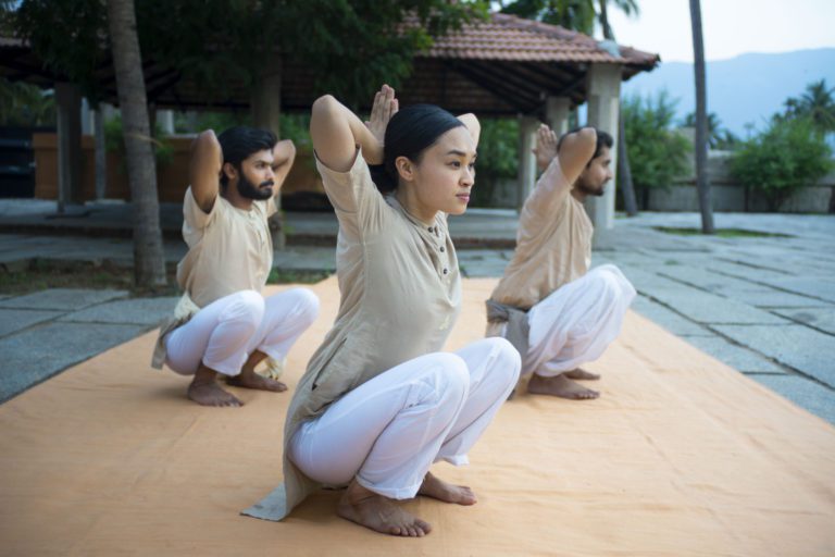 Group of children practicing Upa Yoga poses together